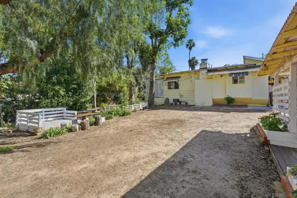 a view of a backyard with a garden
