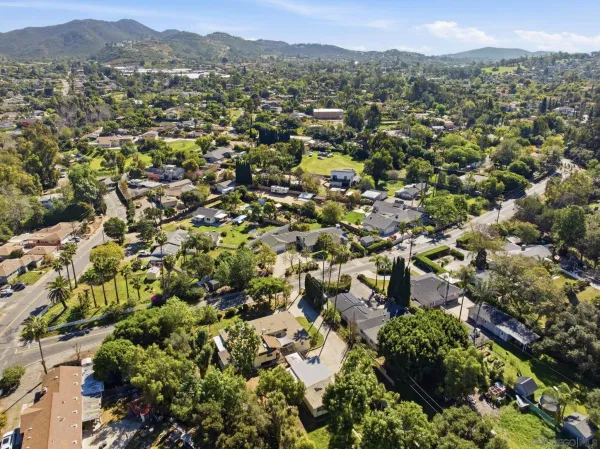 an aerial view of a city with mountains