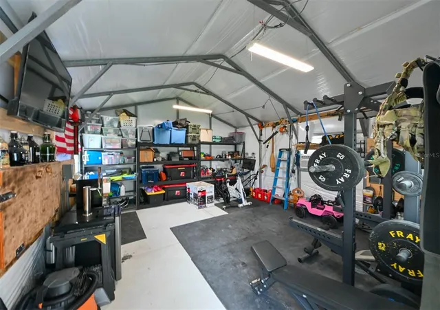 a view of a garage with a bike and car