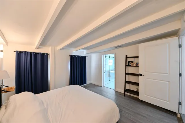 a bedroom with a bed and a closet