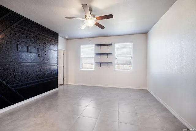 a view of a kitchen with a dishwasher cabinet and a fireplace