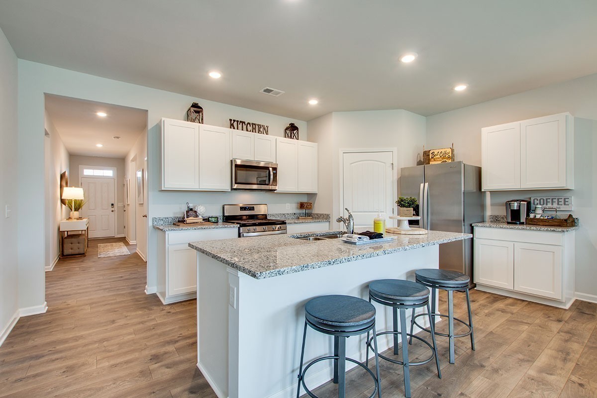 1225 Bufflehead Way Lebanon, TN 37090 - Photo 6 of 23 a kitchen with sink a microwave and cabinets