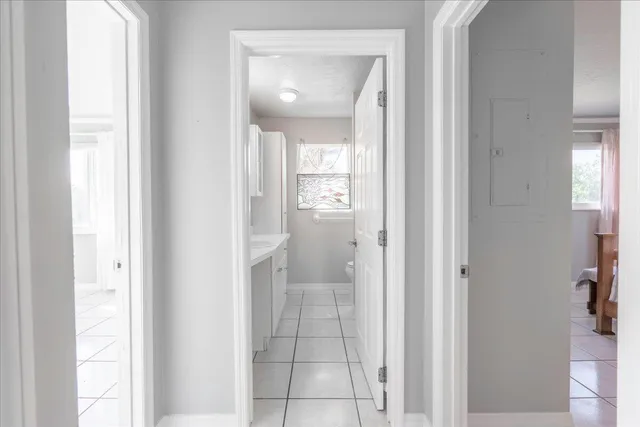 a bathroom with a glass shower door