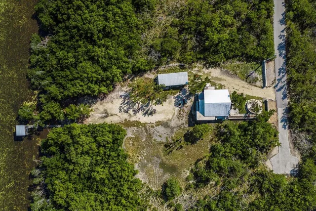 a aerial view of a house with a yard
