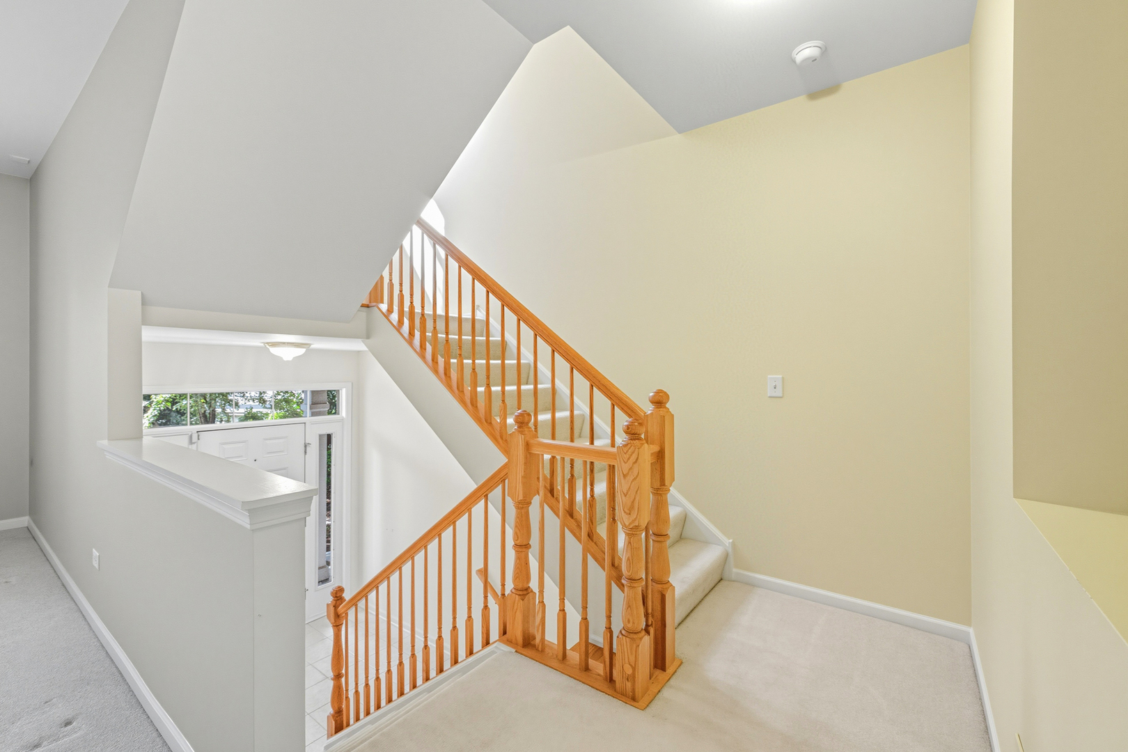5662 Cambridge Way Hanover Park, IL 60133 - Photo 18 of 34 a view of staircase with wooden floor and white walls