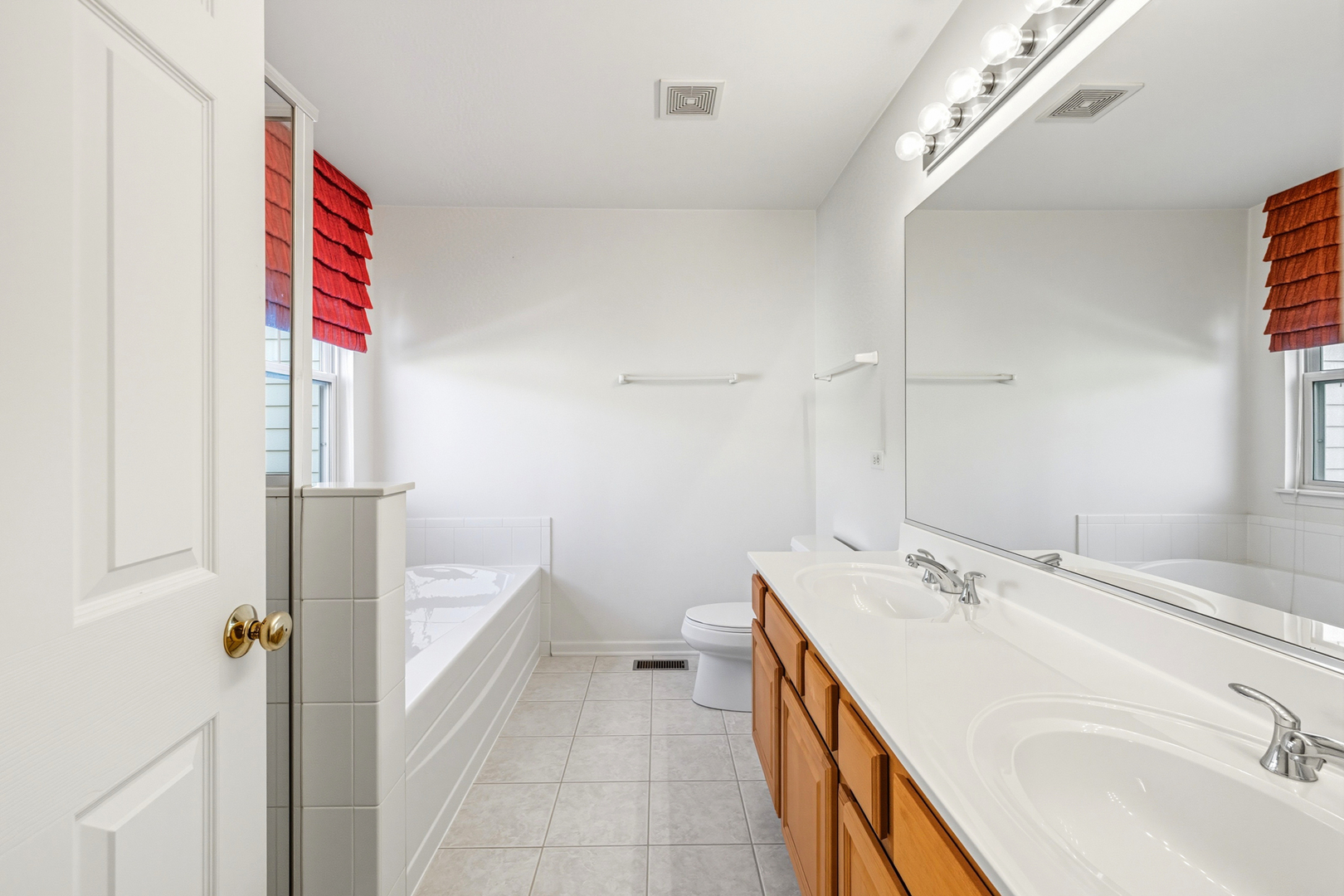 5662 Cambridge Way Hanover Park, IL 60133 - Photo 21 of 34 a bathroom with a sink and a mirror