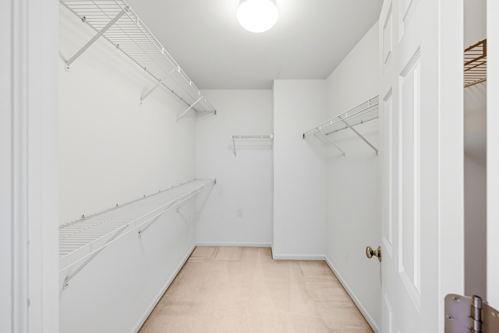 5662 Cambridge Way Hanover Park, IL 60133 - Photo 23 of 34 a view of an empty walk in closet