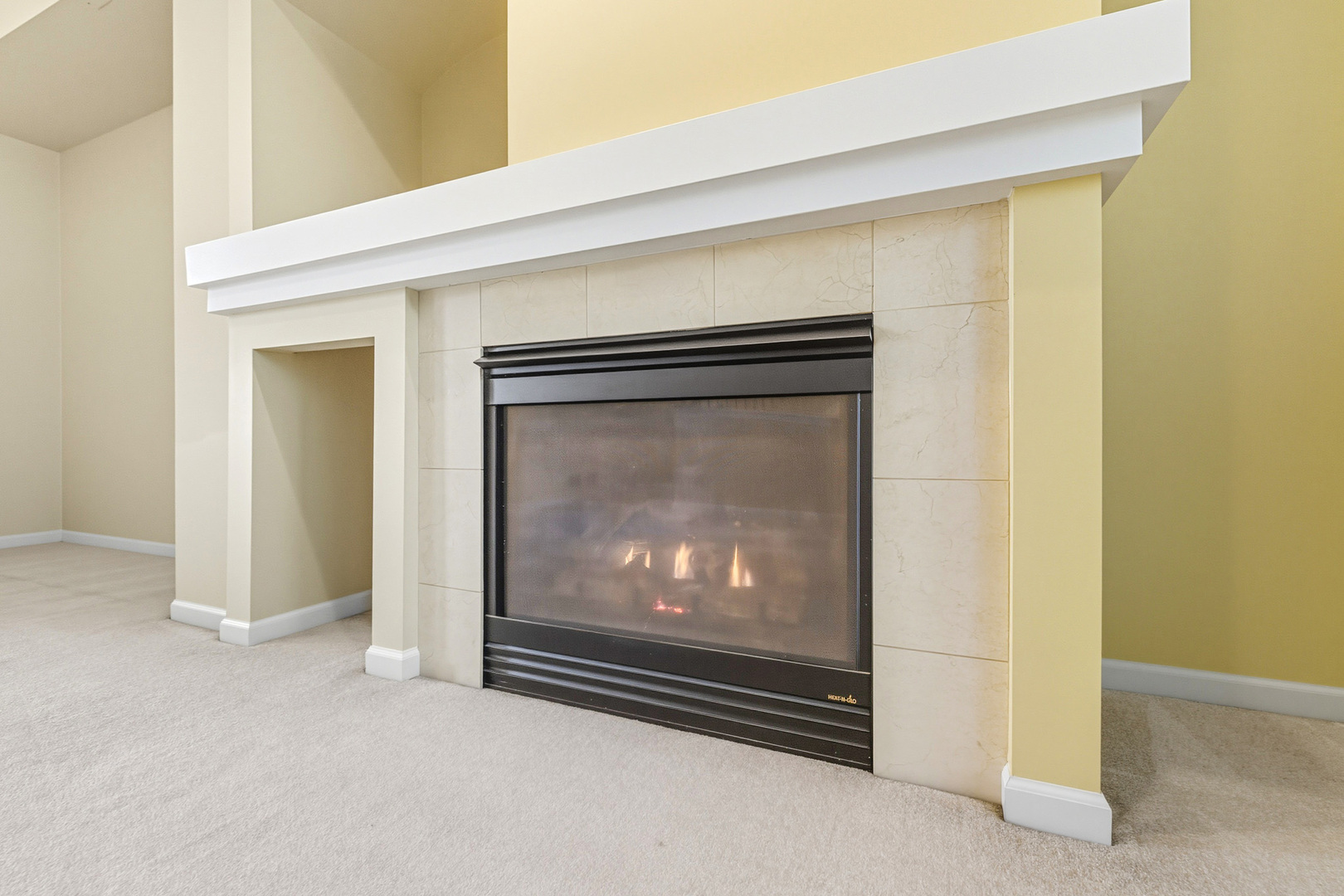 5662 Cambridge Way Hanover Park, IL 60133 - Photo 8 of 34 a living room with a fireplace