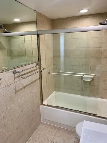 a bathroom with a shower and a bathtub