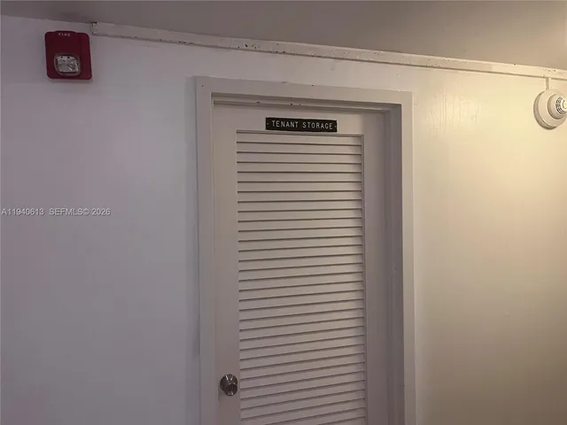 a bathroom with a toilet and a shower curtain