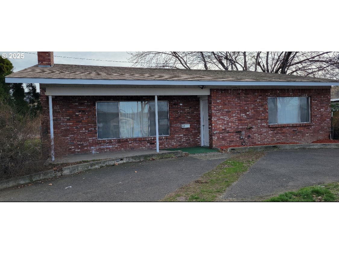 a front view of a house with a garage