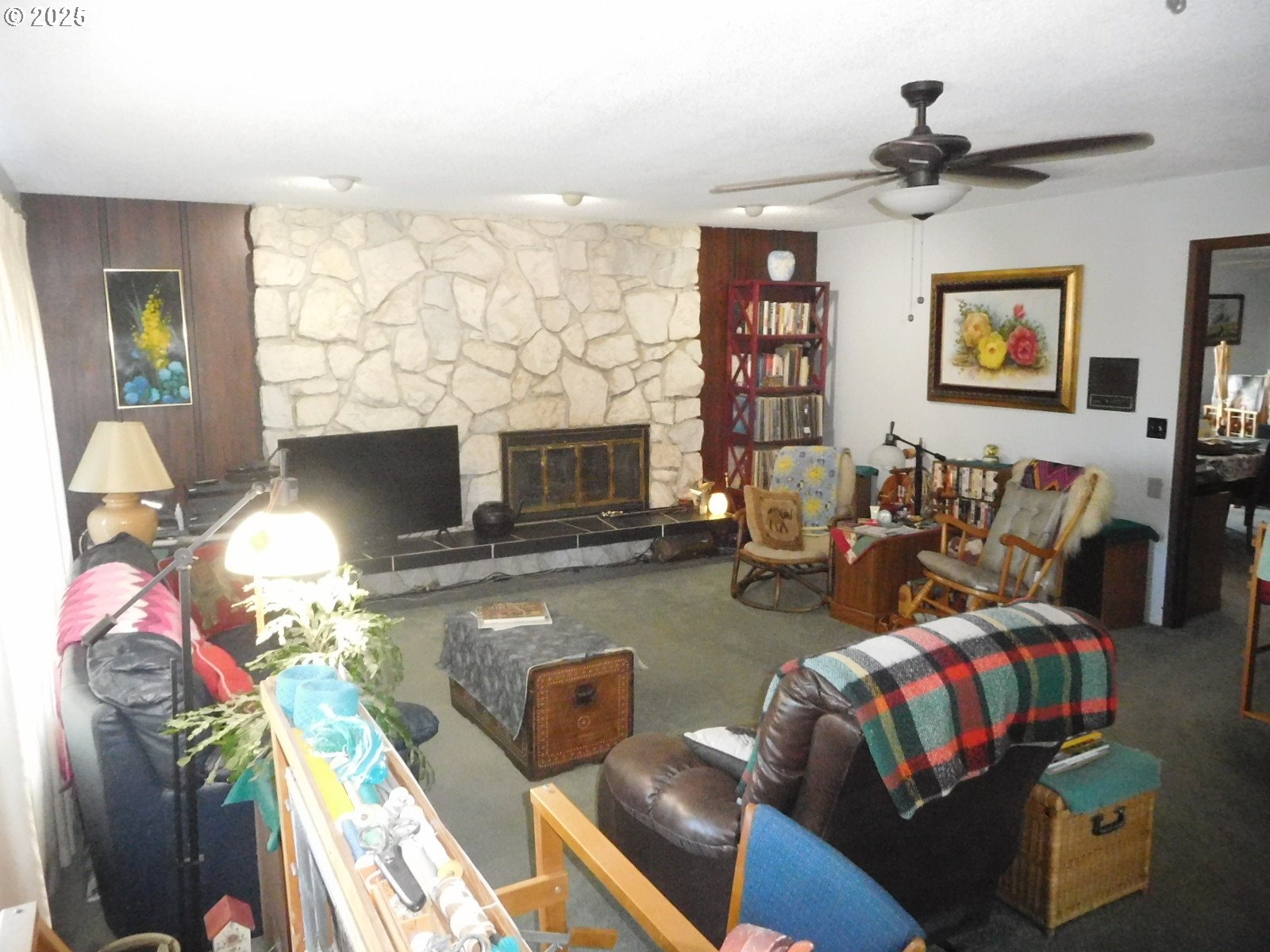 117 North Main Street Milton Freewater, OR 97862 - Photo 12 of 21 a living room with fireplace furniture and a flat screen tv