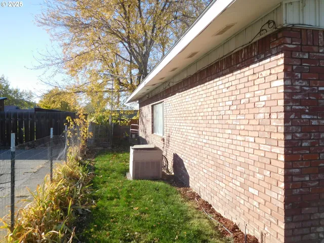 a backyard of a house with outdoor seating