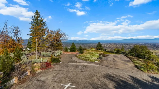 a view of a road with a building in the background