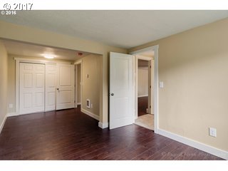 13240 Southeast Rusk Road Milwaukie, OR 97222 - Photo 13 of 24 a view of an empty room with wooden floor