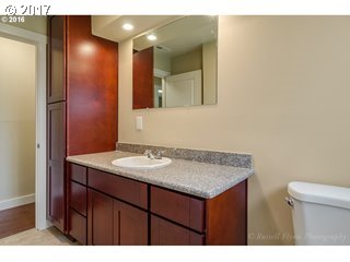 13240 Southeast Rusk Road Milwaukie, OR 97222 - Photo 15 of 24 a bathroom with a sink and a mirror