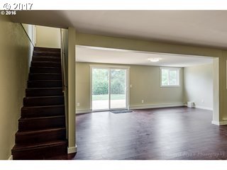 13240 Southeast Rusk Road Milwaukie, OR 97222 - Photo 17 of 24 a view of an empty room with wooden floor and windows