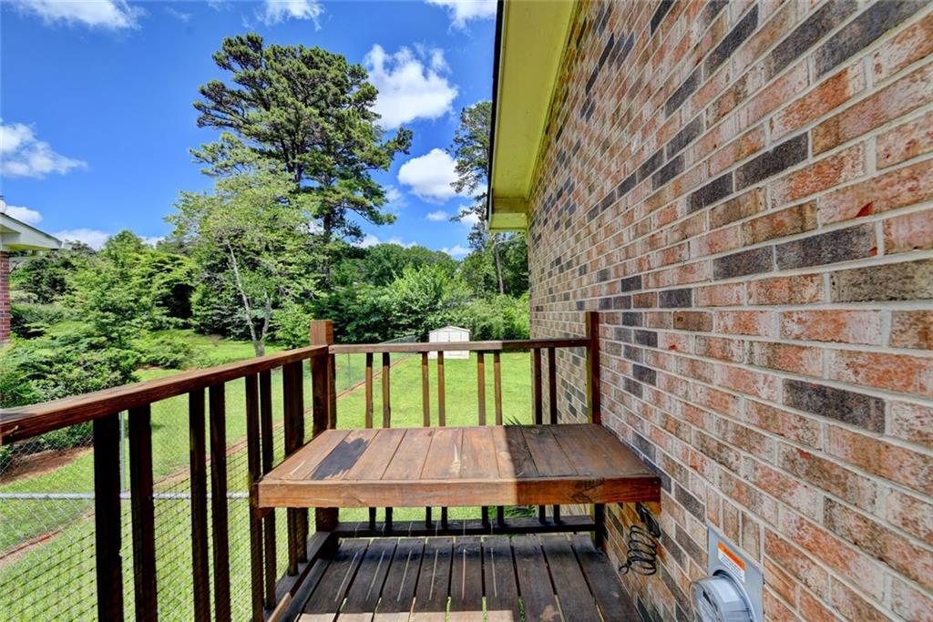1577 Harbour Oaks Road Tucker, GA 30084 - Photo 52 of 58 a view of balcony with wooden floor and outdoor seating