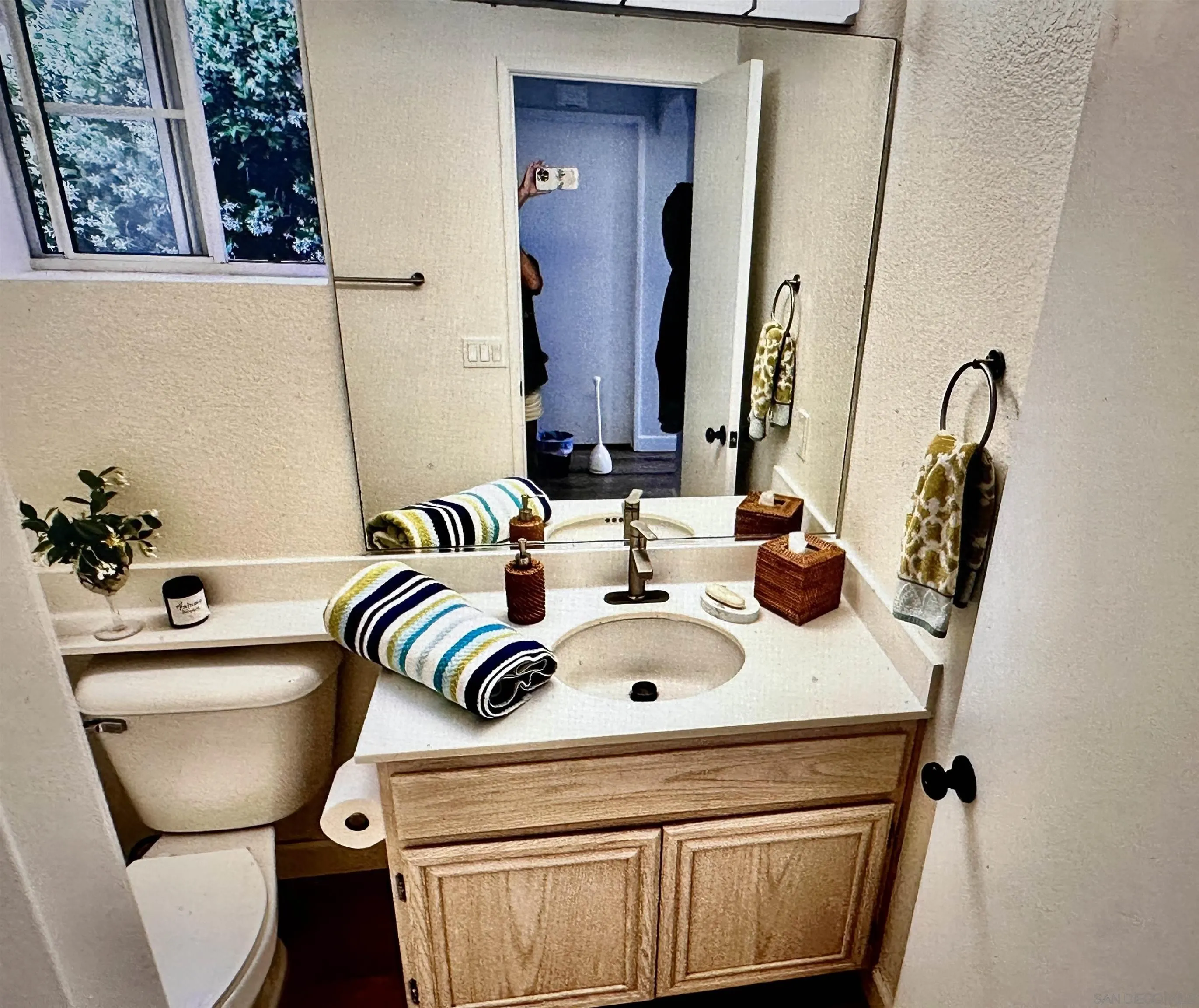 1259 Natoma Way, Unit C Oceanside, CA 92057 - Photo 22 of 52 a bathroom with a sink and a toilet