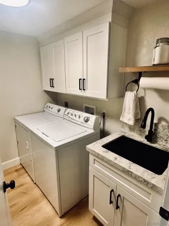 a utility room with dryer and washer