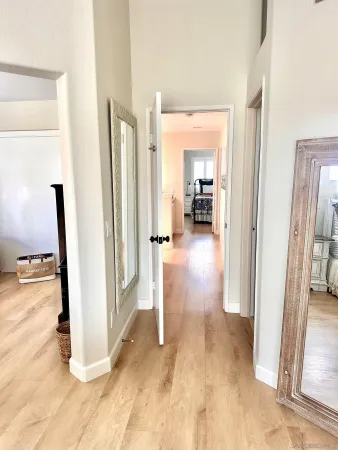 a bedroom with a large bed and a mirror