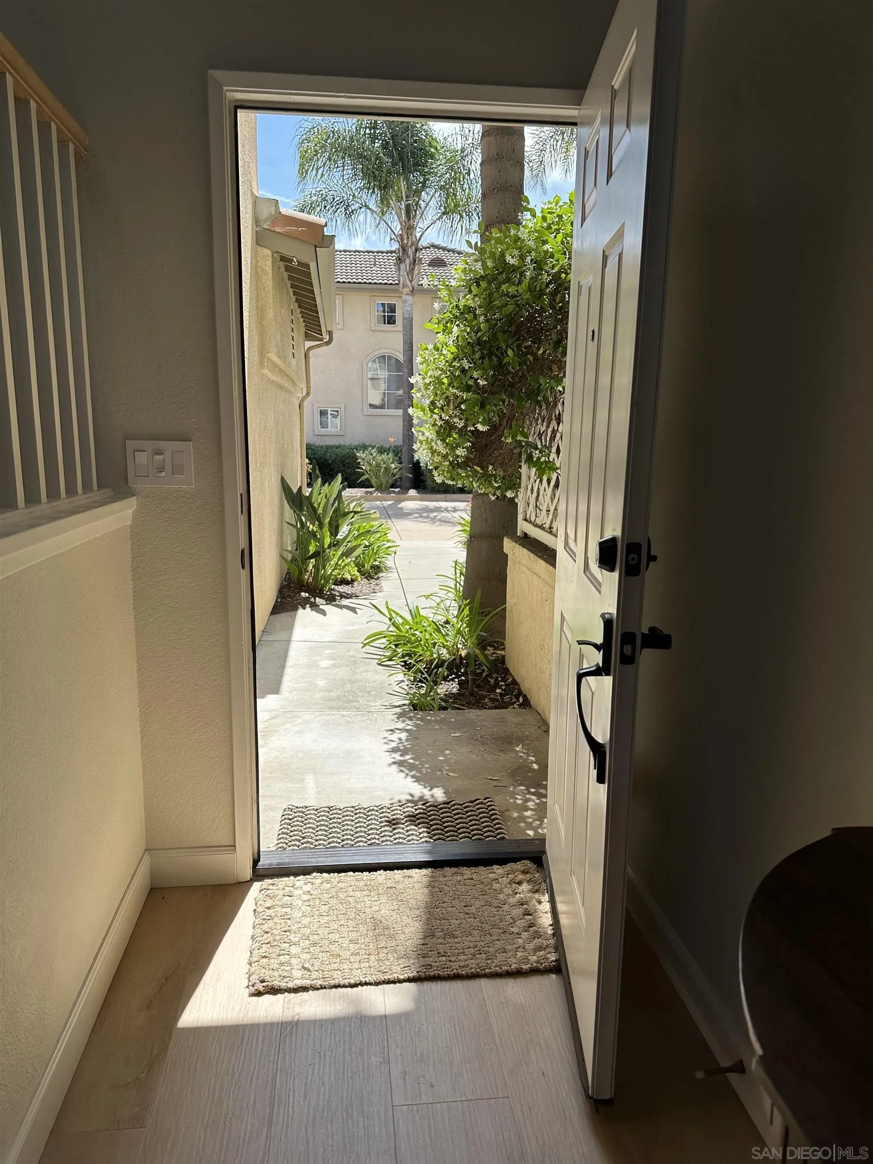1259 Natoma Way, Unit C Oceanside, CA 92057 - Photo 40 of 52 a view of a porch with wooden floor