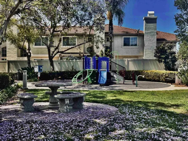 an outdoor space with lots of trees in the background