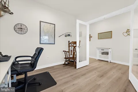 a spacious bedroom with a bed and a window