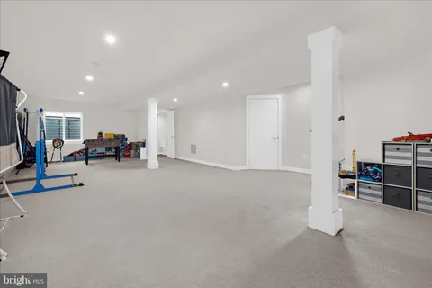 a view of a kitchen with a sink and cabinets