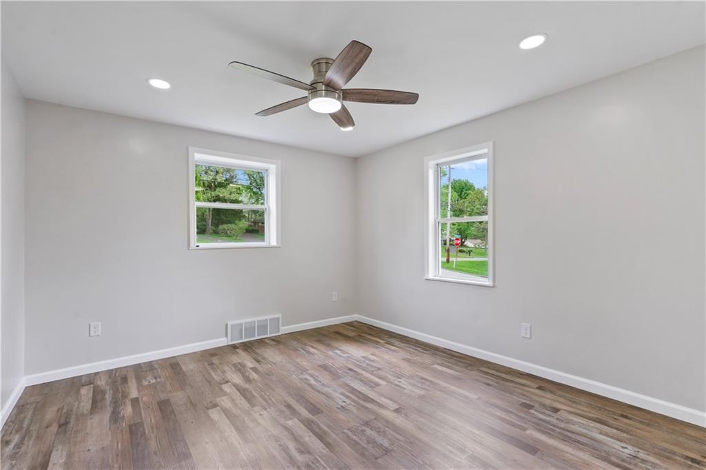 951 Shenango Road Beaver Falls, PA 15010 - Photo 13 of 25 a view of empty room with wooden floor and fan