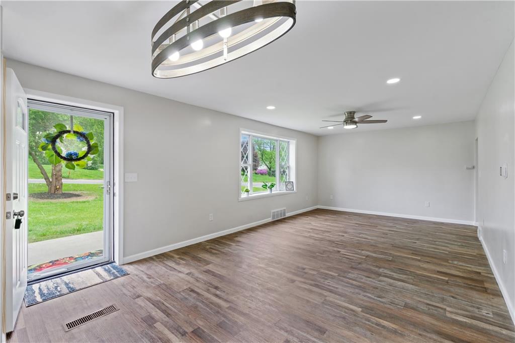 951 Shenango Road Beaver Falls, PA 15010 - Photo 7 of 25 an empty room with wooden floor and a window