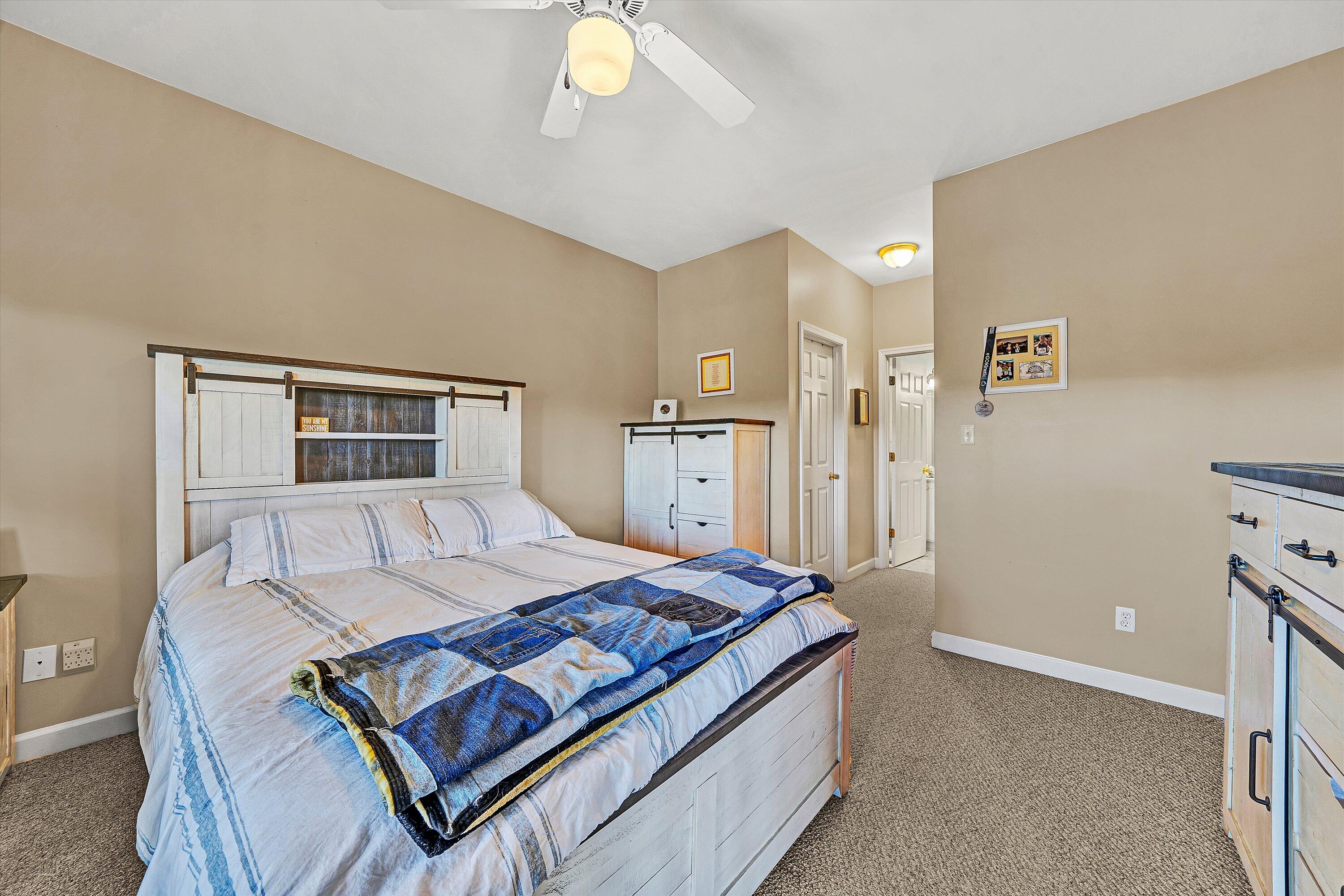 1103 Mariners Way, Unit 1 Huddleston, VA 24104 - Photo 18 of 27 a living room with furniture and a table