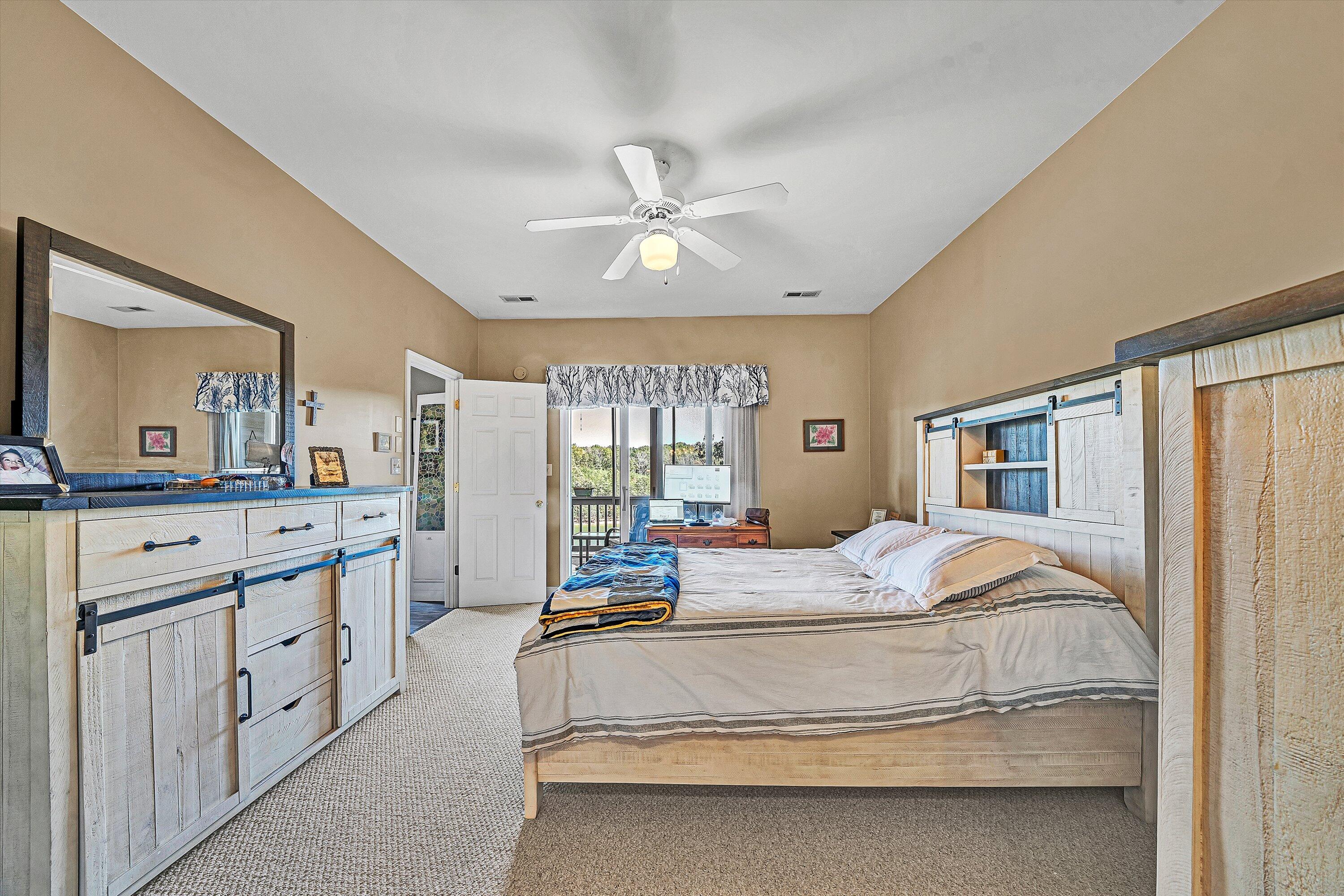 1103 Mariners Way, Unit 1 Huddleston, VA 24104 - Photo 20 of 27 a bedroom with a large bed and a chandelier