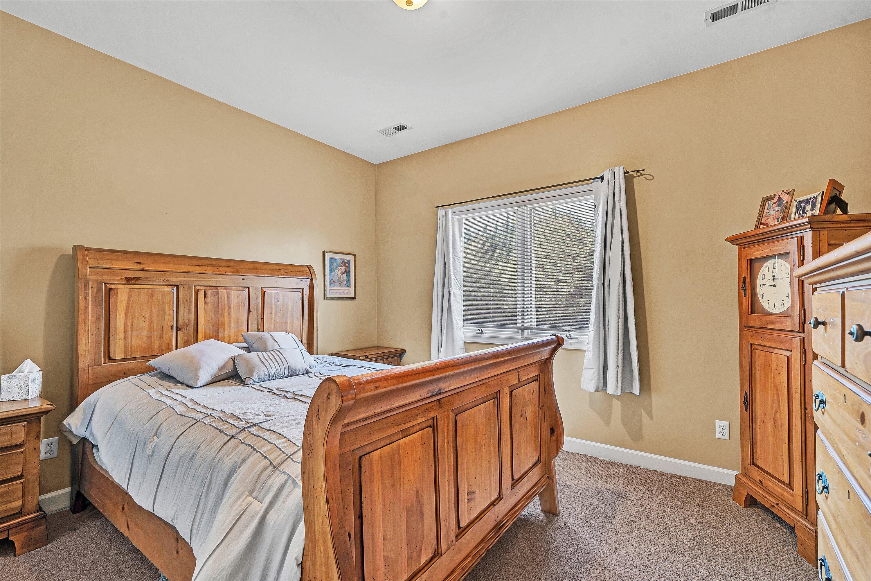 1103 Mariners Way, Unit 1 Huddleston, VA 24104 - Photo 22 of 27 a bedroom with a bed and a window