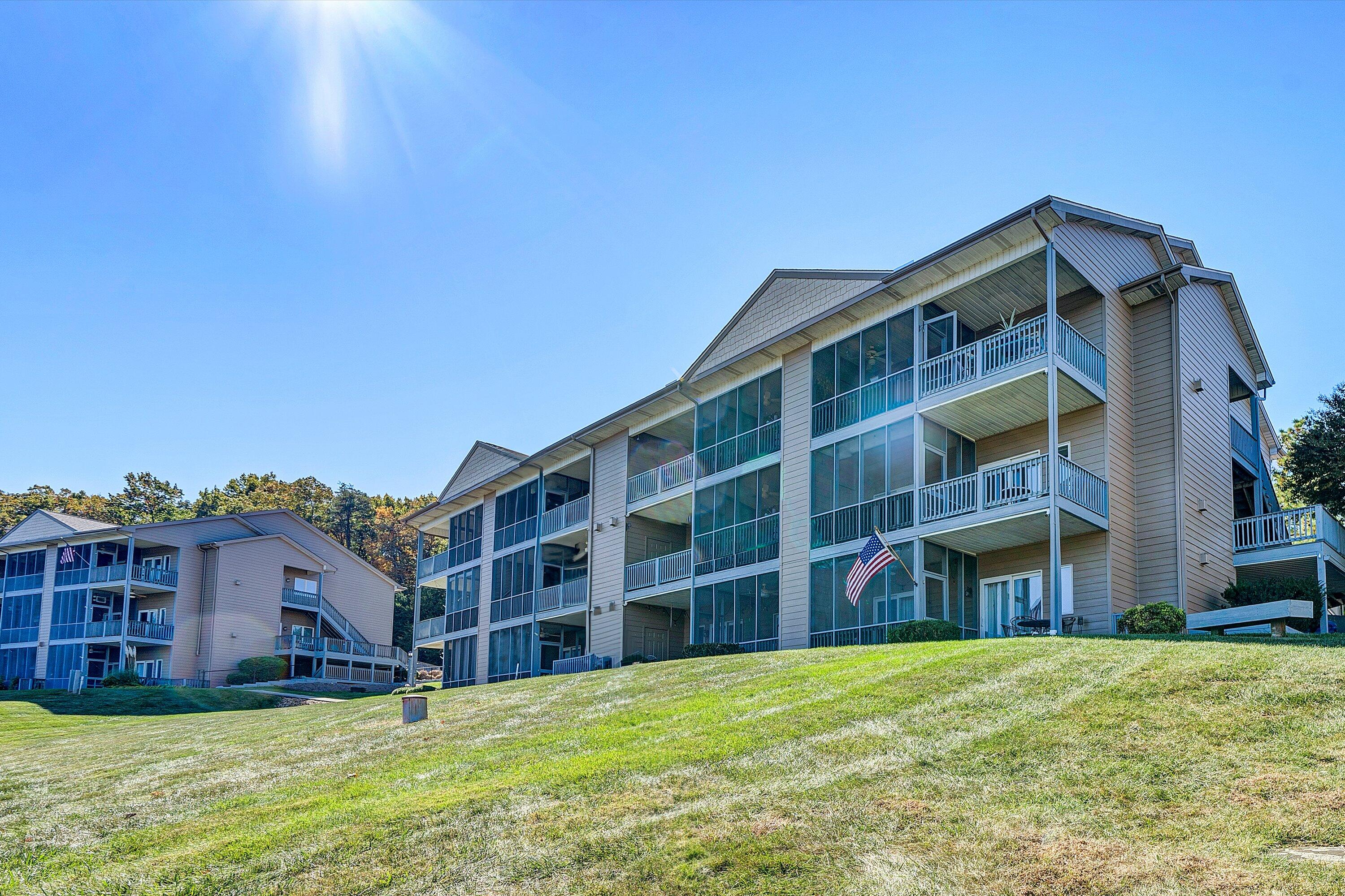 1103 Mariners Way, Unit 1 Huddleston, VA 24104 - Photo 24 of 27 a view of building with a yard