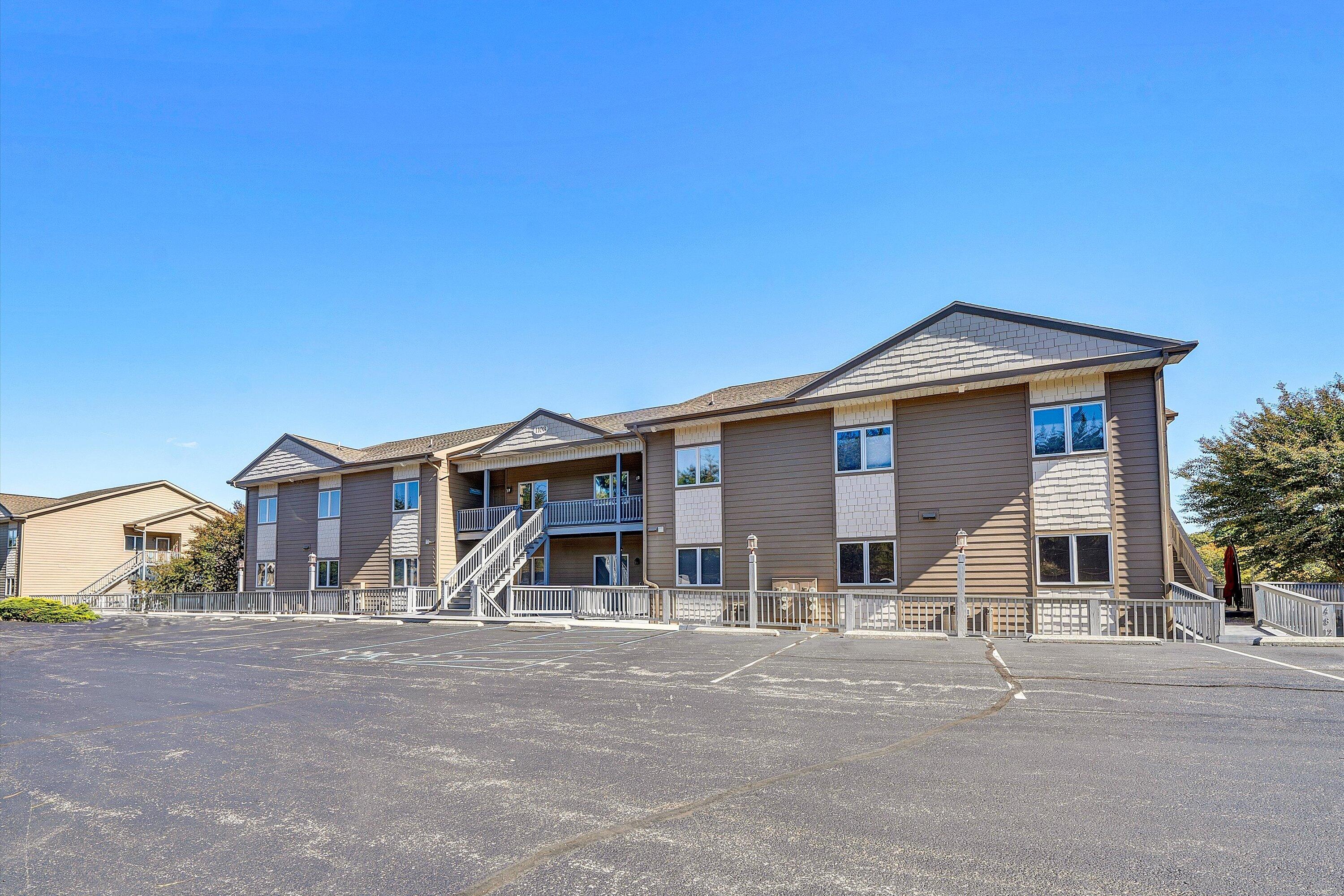1103 Mariners Way, Unit 1 Huddleston, VA 24104 - Photo 3 of 27 a front view of a house with a yard