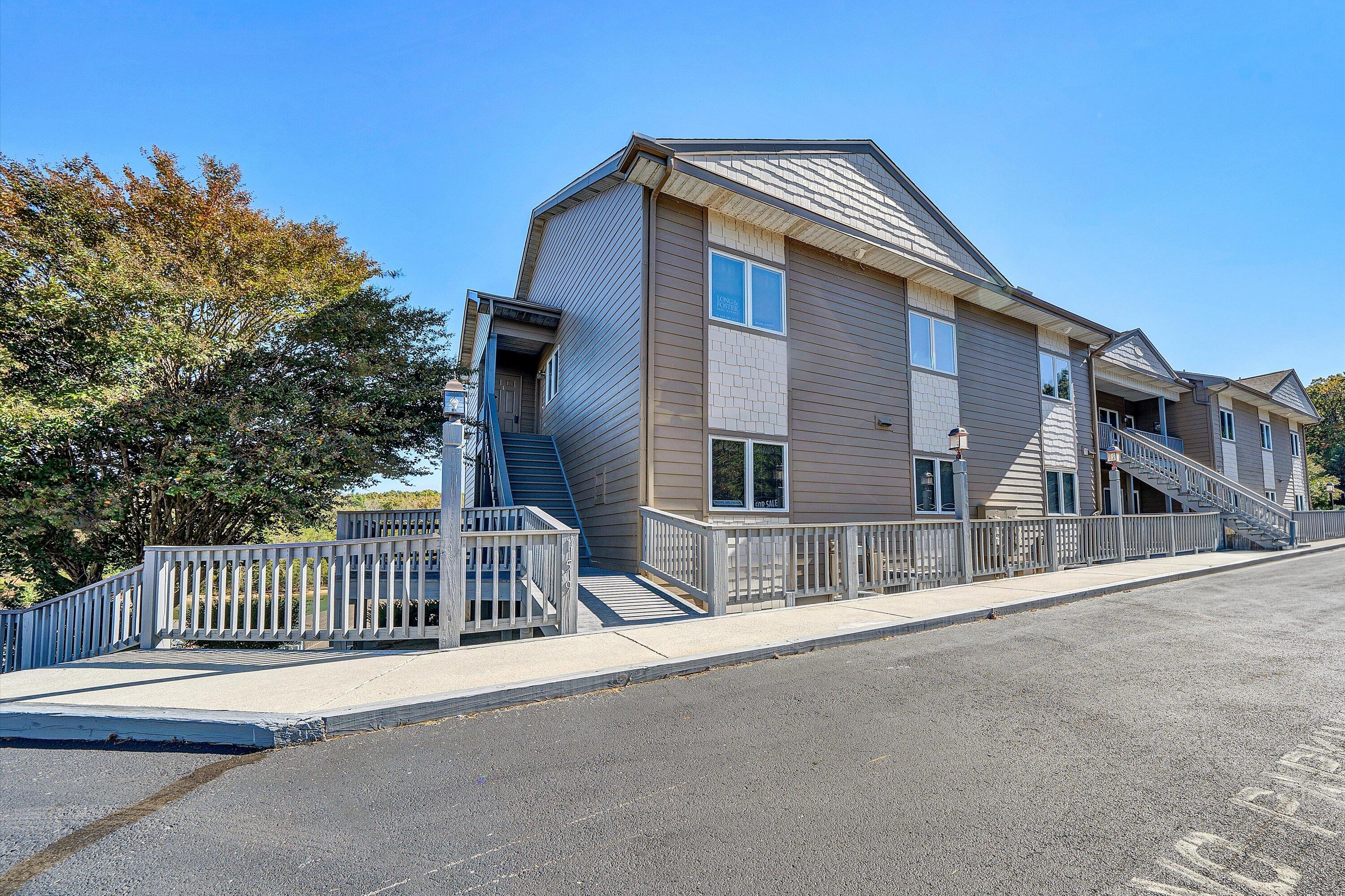1103 Mariners Way, Unit 1 Huddleston, VA 24104 - Photo 4 of 27 a front view of a house with a fence
