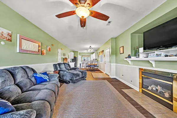 a living room with furniture and a flat screen tv