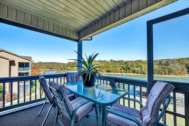a view of a balcony with furniture