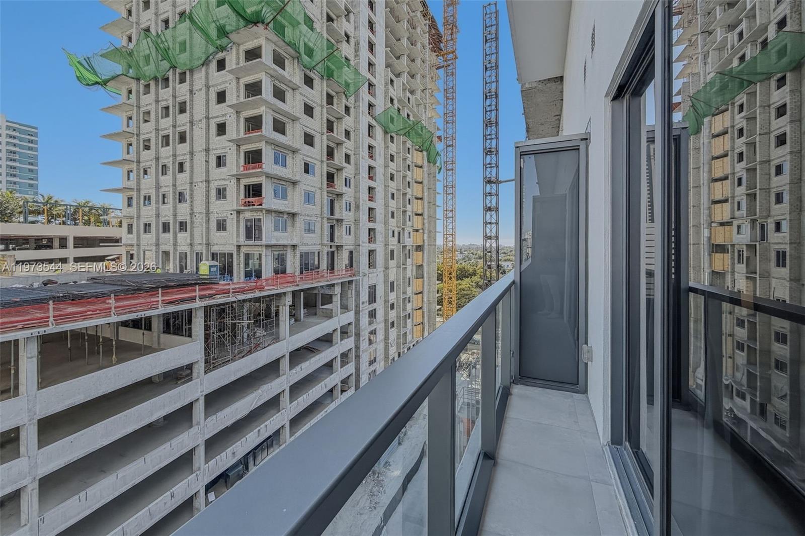 229 Southwest 9th Street, Unit 407 Miami, FL 33130 - Photo 25 of 29 a view of balcony with wooden stairs
