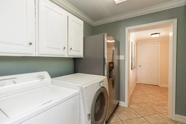a view of storage and utility room with washer and dryer