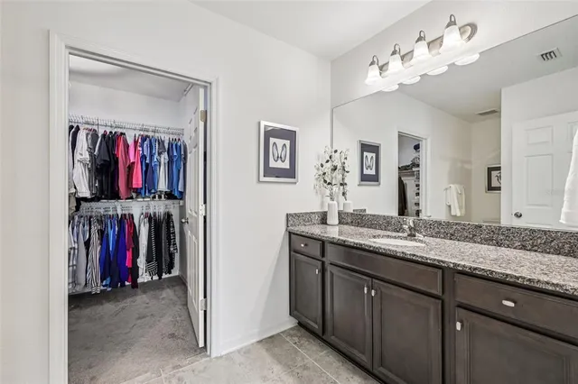 a view of a double sink and mirror in a room