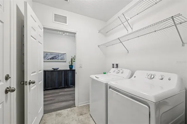 a utility room with dryer and washer