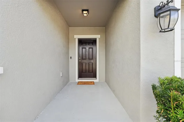 a view of an entryway with wooden floor