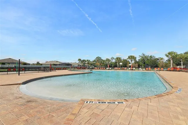a view of a swimming pool and an outdoor space