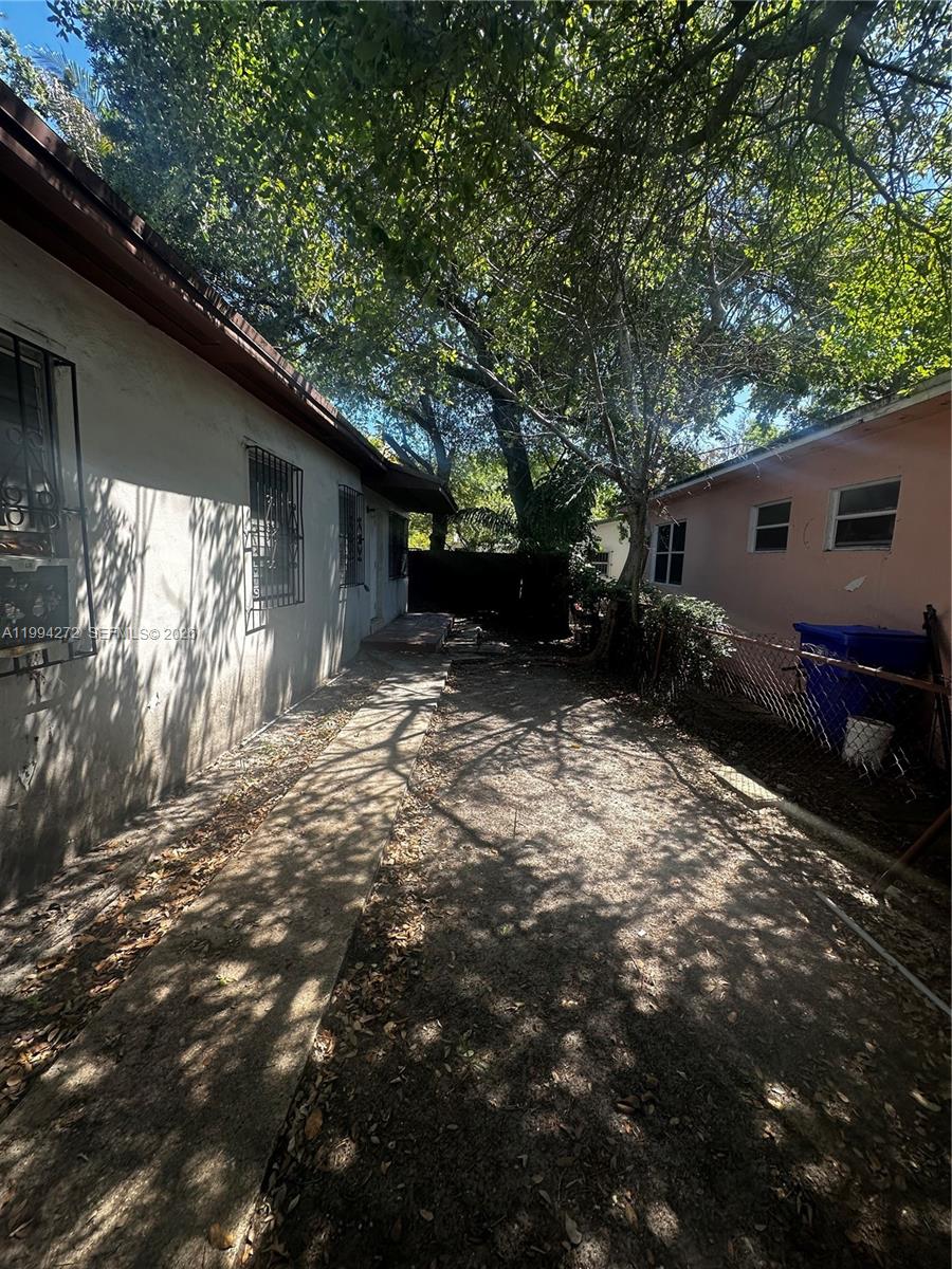 112 Northeast 63rd Street, Unit 112 Miami, FL 33138 - Photo 1 of 18 a backyard of a house with lots of green space