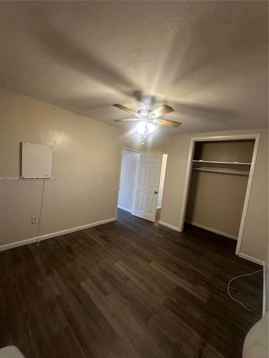 112 Northeast 63rd Street, Unit 112 Miami, FL 33138 - Photo 11 of 18 an empty room with wooden floor and natural light