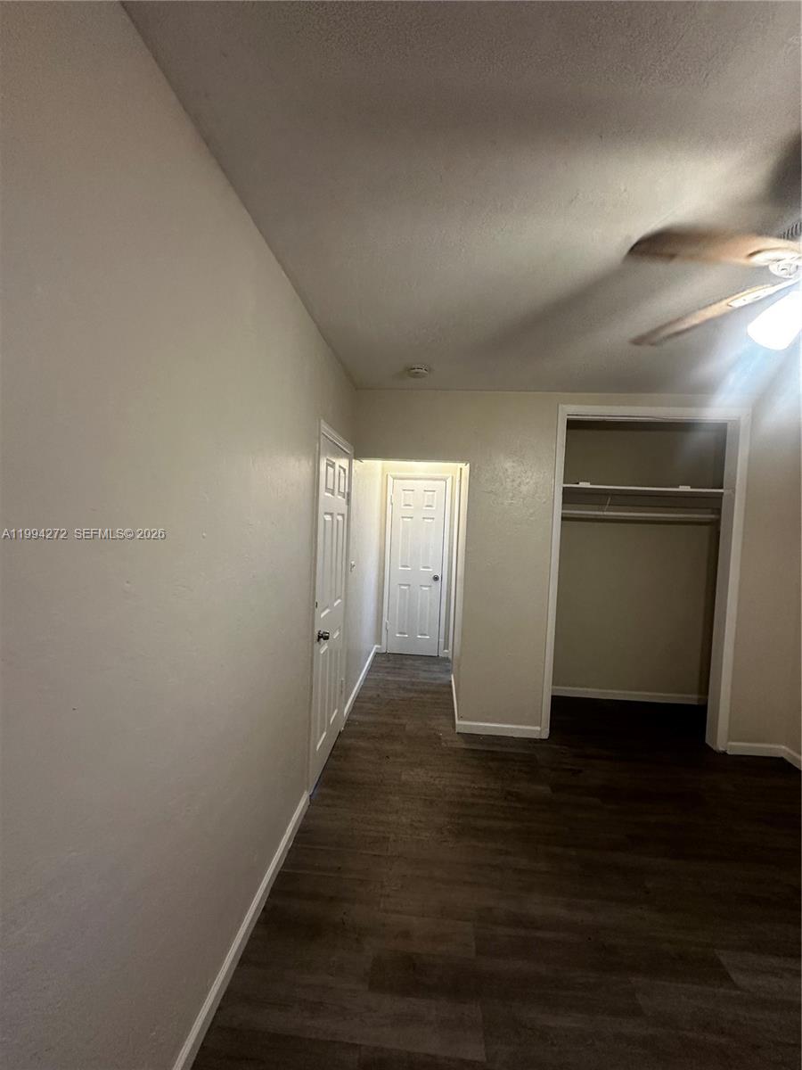 112 Northeast 63rd Street, Unit 112 Miami, FL 33138 - Photo 14 of 18 a view of an empty room with wooden floor and closet