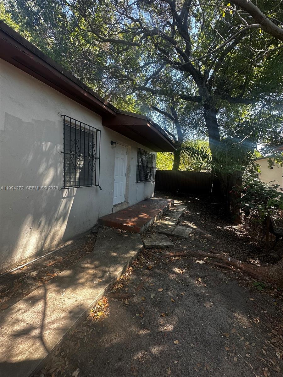 112 Northeast 63rd Street, Unit 112 Miami, FL 33138 - Photo 2 of 18 a front view of a house with a yard