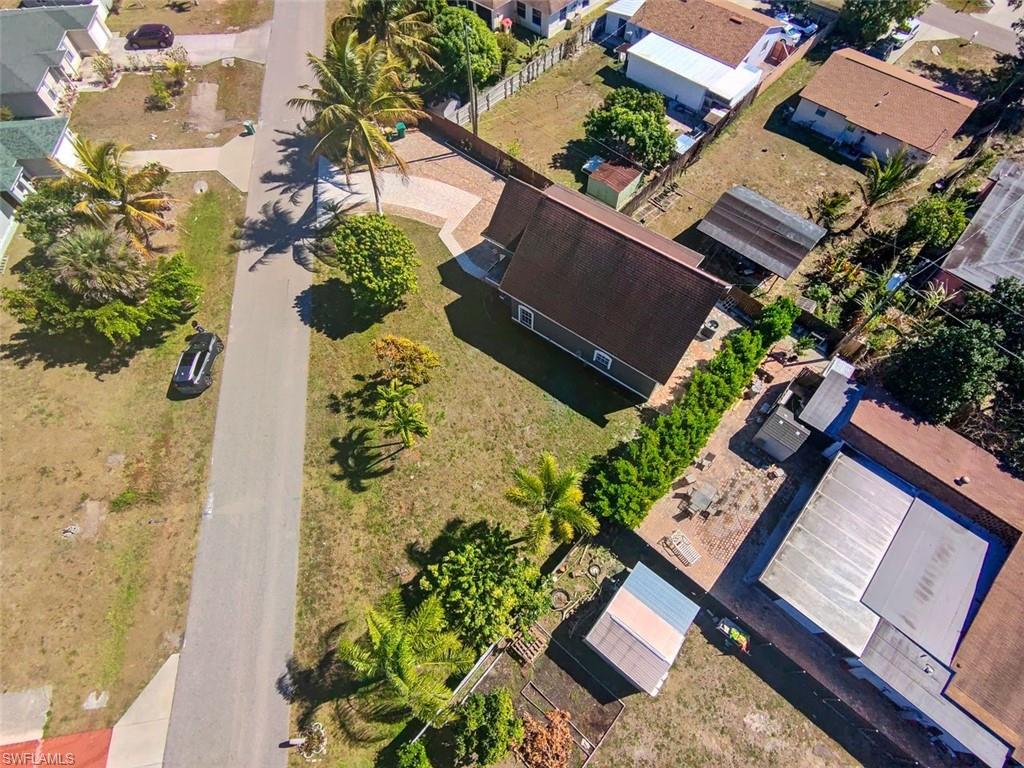 Undisclosed Address Naples, FL 34113 - Photo 1 of 21 an aerial view of a house with a yard